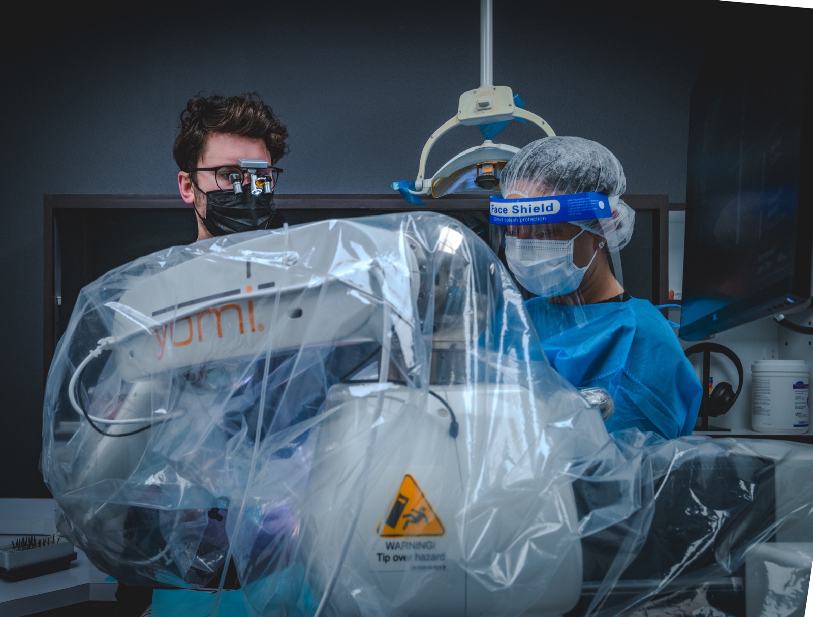 Robot-assisted implant surgery with the Yomi system
