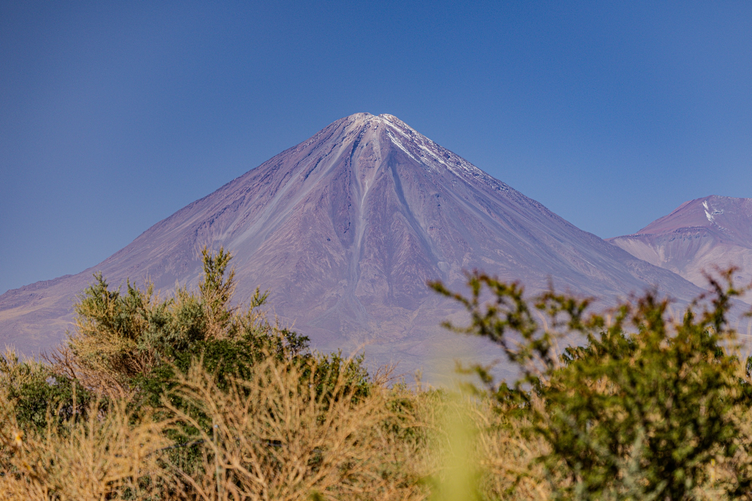 A volcano rising over the Atacama scrub