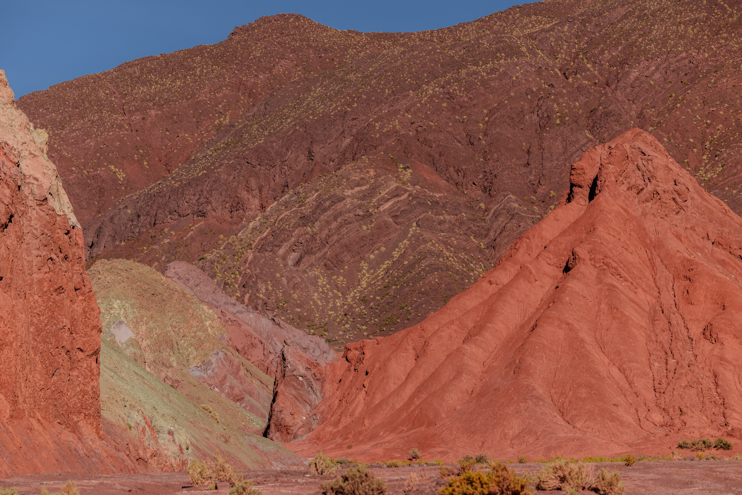 Red rock mountains under afternoon light