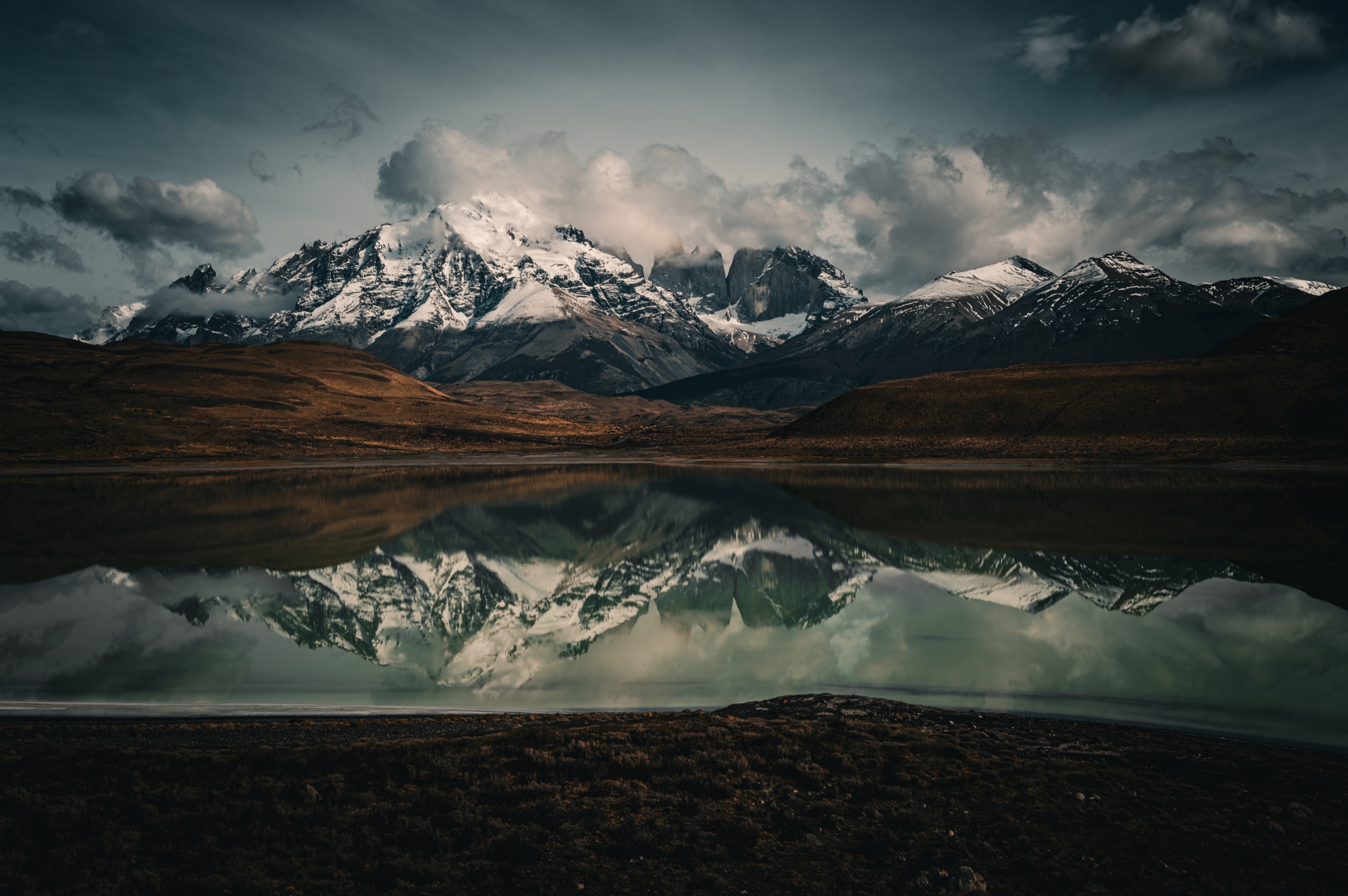 Snowbound peaks reflected in a still lake