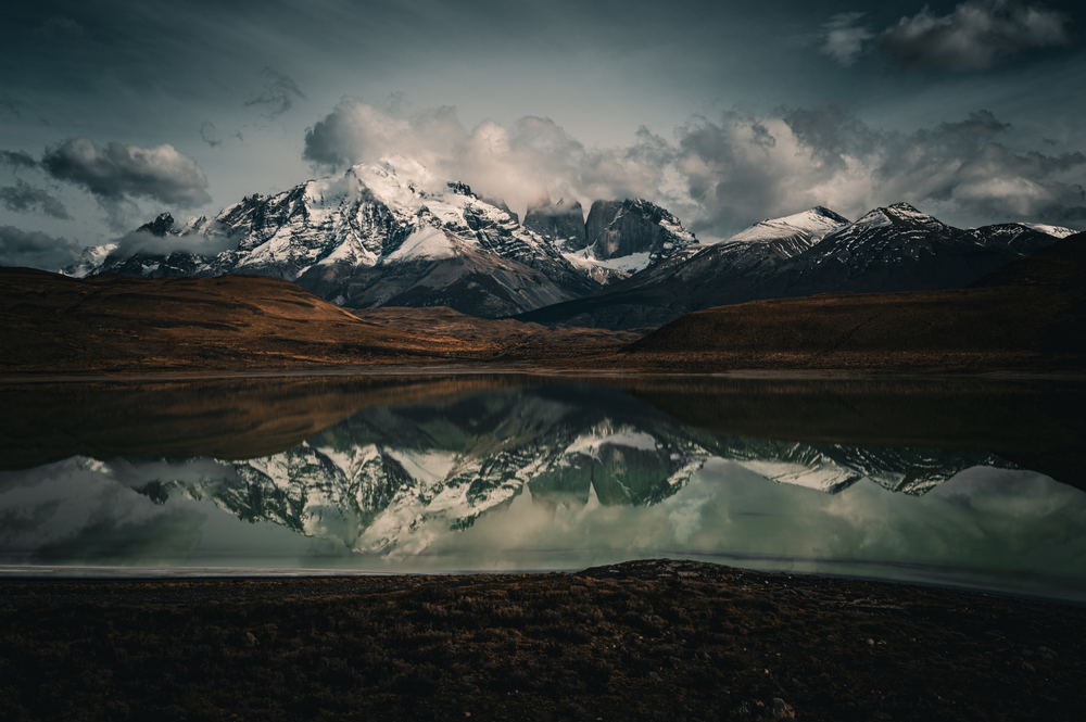 Snowbound peaks reflected in a still lake
